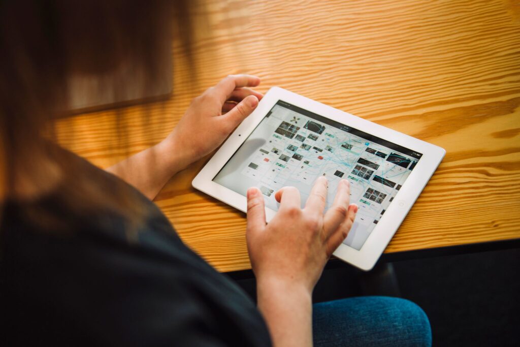 Image of female scrolling Figma Designs on iPad