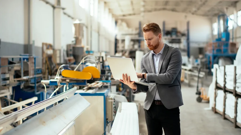 A man trying to protect a manufacturing business against AI cyberattack